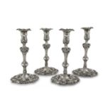 A FINE SET OF FOUR IRISH GEORGIAN SILVER TABLE CANDLESTICKS, Dublin c.1760, makers mark of Michael