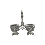 A FRENCH WHITE METAL DOUBLE SALT STAND, c.1835, the twin sconce shaped stands with clear glass