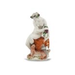 A GERMAN PORCELAIN FIGURE, Ludwigsburg, modelled as a classical female figure holding a tambourine