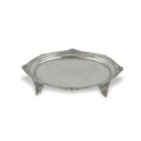 A SMALL SILVER CIRCULAR WAITER, London 1929, with shell and bead border and raised on four blind