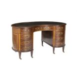 AN EDWARDIAN INLAID MAHOGANY KIDNEY SHAPED LADIES WRITING DESK, by Maple & Co., the top inset with a
