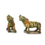 A PAIR OF CHINESE SANCAI GLAZED POTTERY LIONS, in Tang Dynasty style, modelled in mirror image