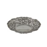 A LATE VICTORIAN SILVER OVAL CAST AND PIERCED BON BON DISH, London 1893, with chased and engraved