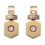 A PAIR OF DIAMOND AND GOLD EARCLIPS Each designed as an octagonal-shaped plaque, set to the centre