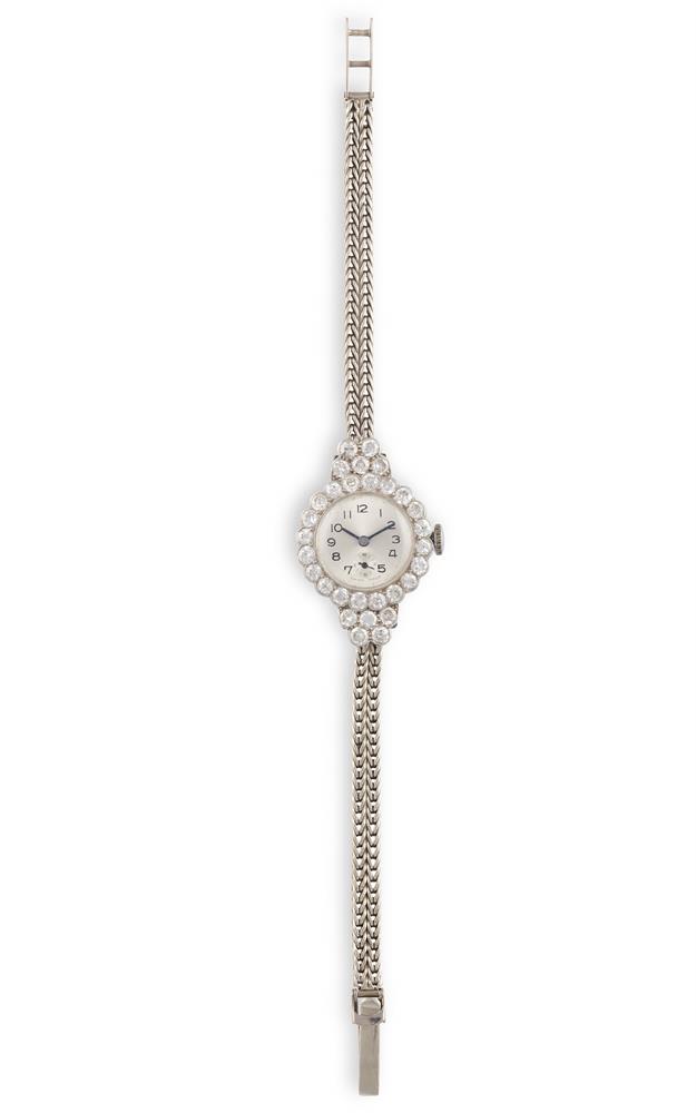 A LADY'S GOLD AND DIAMOND-SET COCKTAIL WATCH17-jewel manual wind movement, with circular dial with