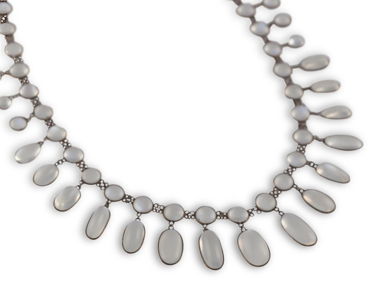 AN EARLY 20TH CENTURY MOONSTONE FRINGE NECKLACEComposed of a series of circular and oval cabochon