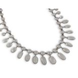 AN EARLY 20TH CENTURY MOONSTONE FRINGE NECKLACEComposed of a series of circular and oval cabochon