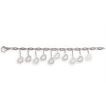 A DIAMOND-SET CHARM BRACELETThe elongated cable-link bracelet, suspending ten heart-shaped charms,