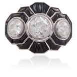 AN ART DECO DIAMOND AND ONYX RINGOf stylised scalloped form, set centrally with an old round