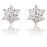 A PAIR OF DIAMOND EAR STUDSEach centred by a round brilliant-cut diamond, to a surround of