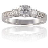 A DIAMOND SINGLE-STONE RINGThe round brilliant-cut diamond, weighing approximately 0.61ct, between