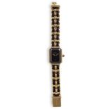 A LADY'S GOLD PLATED QUARTZ WRISTWATCH, BY CHANEL, CIRCA 1987ETA Quartz movement, black dial with