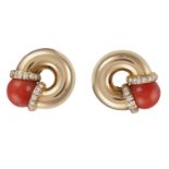 A PAIR OF CORAL AND DIAMOND EARCLIPSEach designed as a round hoop, set with a coral bead with