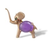 AN AMETHYST AND EMERALD NOVELTY BROOCHModelled as a small elephant, the body set with an oval-shaped