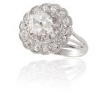 A DIAMOND CLUSTER RINGThe old pear-shaped diamond weighing 1.79cts, within a surround of old