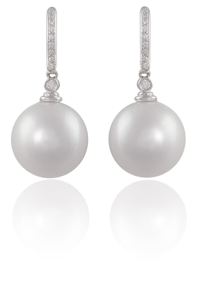 A PAIR OF CULTURED PEARLS AND DIAMOND PENDENT EARRINGSEach round-shaped white South Sea cultured