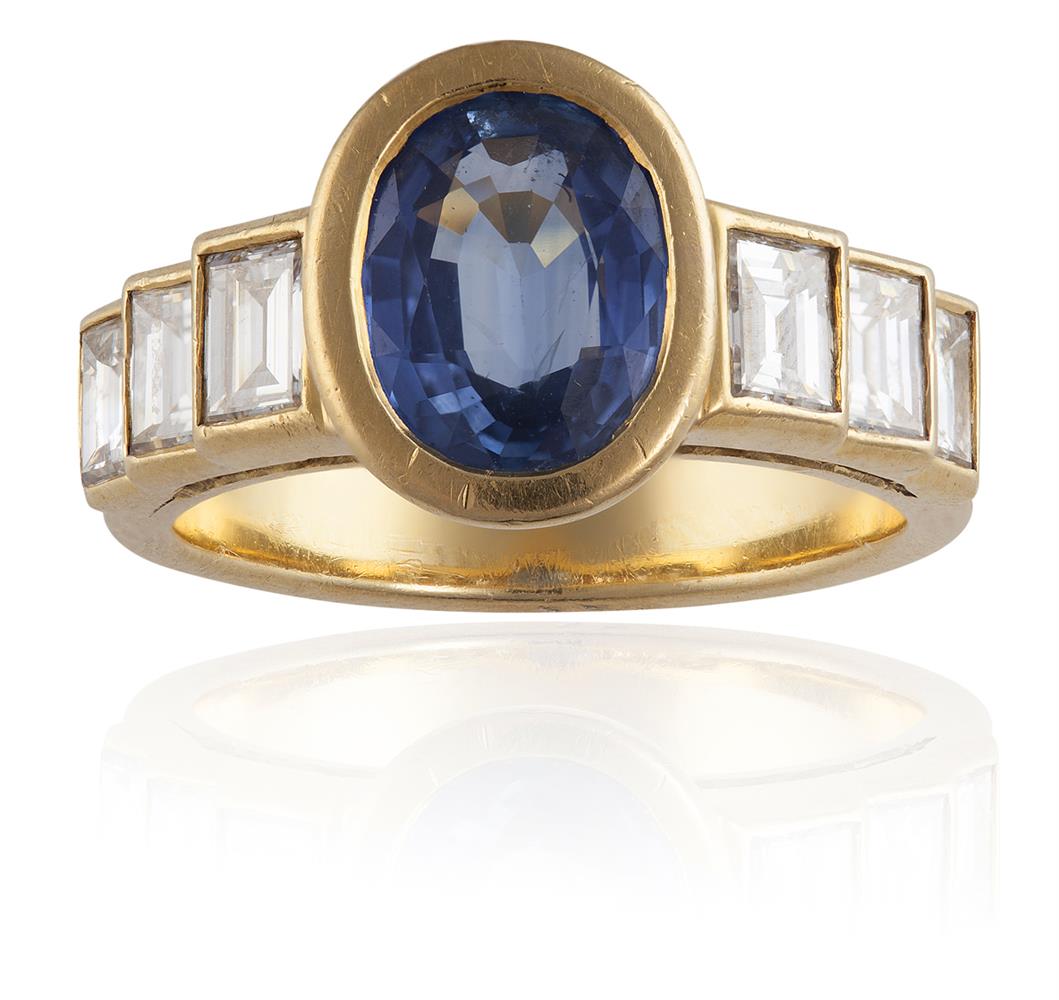 A SAPPHIRE AND DIAMOND RINGThe oval-shaped sapphire, weighing approximately 1.90cts, between