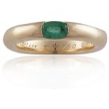 AN EMERALD ELLIPSE RING, BY CARTIERThe oval-shaped emerald set to a plain hoop, mounted in 18K gold,