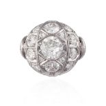 A DIAMOND DRESS RING, CIRCA 1950Of bombé design, centrally set with a round brilliant-cut diamond,