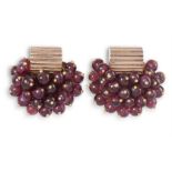 A PAIR OF GARNET EARCLIPS, CIRCA 1940Each earclip designed as a cluster of grapes, set with ruby