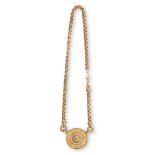 A GOLD AND DIAMOND PENDANT NECKLACE AND EARRINGS EN SUITEThe circular pendant depicting the head