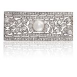 A BELLE EPOQUE DIAMOND AND PEARL BROOCH, CIRCA 1910The rectangular plaque finely pierced and