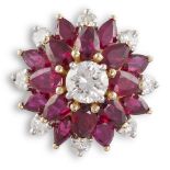 A DIAMOND AND RUBY CLUSTER RINGThe central round brilliant-cut diamond, within two borders of pear-