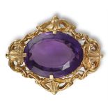 A 19TH CENTURY AMETHYST BROOCHThe oval mixed-cut amethyst, weighing approximately 27.50cts, within a