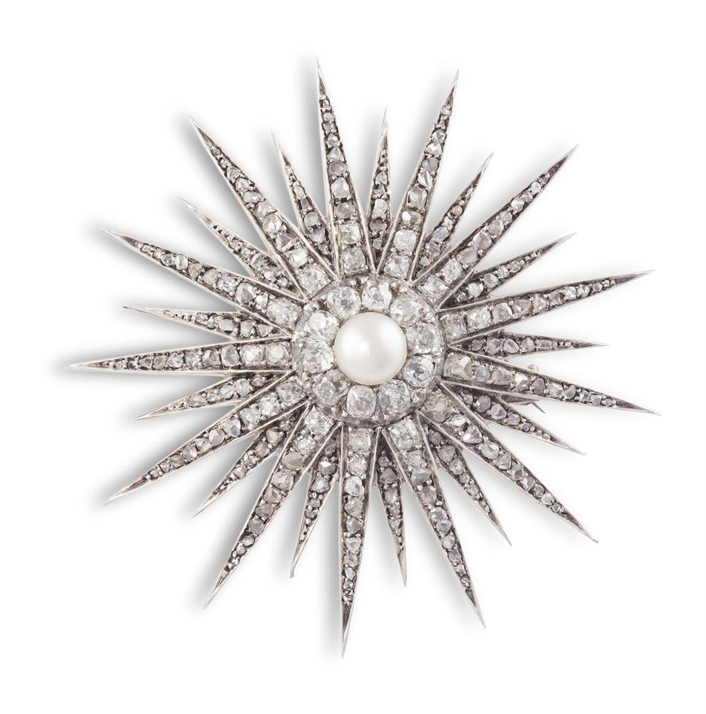 A DIAMOND AND PEARL STAR BROOCH, CIRCA 1890The multi-rayed star set throughout with old cushion