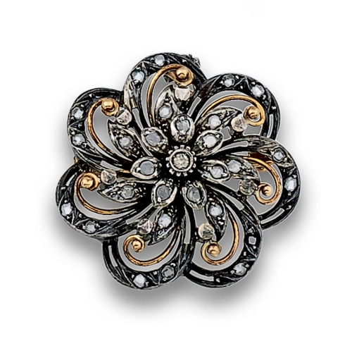 Broche colgante Isabelino en forma de flor. Con diamantes y brillante central .en oro de 18K con