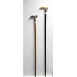 2. Two Victorian gent’s walking canes, each with silver embossed mounts, & one with bone handle (