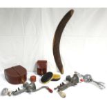 6. A leather horseshoe shaped collar box; a similar stud box; a pair of ebony-backed clothes brushes