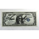 ELVIS PRESLEY, an autographed “Silver Certificate” $1 bill; obtained during a concert in Las Vegas