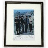 ROLLING STONES, a publicity photo of the band standing on a terrace, signed by Brian Jones, Keith