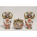 A pair of Copeland Spode porcelain ovoid two-handled vases with oriental floral decoration within