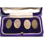 A pair of 9ct. gold cuff-links with plain oval panels; Chester 1920. (6.5gm).