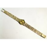 A Marvin Revue ladies’ wristwatch with oval champagne dial & gilt baton numerals, in 9ct. gold