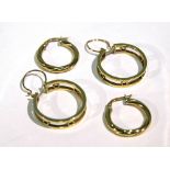 A pair of 18ct. gold circular openwork earrings; & a pair of 18ct. circular spiral-twist ditto. (