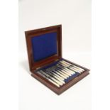 Twelve pairs of Victorian dessert knives & forks with carved mother-of-pearl handles (one fork