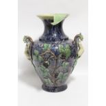 A 19th century continental faience large ovoid vase of mottled blue ground, with cariatide side