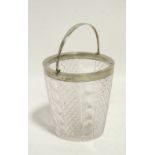 An Edwardian cut-glass ice pail of tapered cylindrical form, with silver rim & swing handle, 5½”
