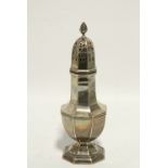 An Edwardian octagonal baluster sugar castor on pedestal foot, 8¾" high; Birmingham 1905, by Henry