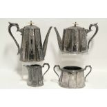 A Victorian four-piece tea & coffee service of oval tapered & fluted form with engraved decoration.