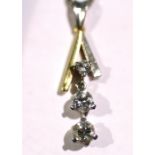 A DIAMOND PENDANT set three articulated brilliant-cut stones, two approx. 0.3 carat, one approx. 0.