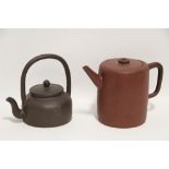 A Chinese Yxing tall cylindrical teapot, 5” high; & another with over-hang handle & incised