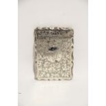 A late Victorian flat rectangular card case with shaped sides & engraved leaf-scroll decoration;