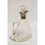 A George V glass claret jug of flat-sided tapered form, with mushroom stopper, & with silver mounted