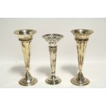 A pair of round tapered posy vases, each on circular foot, 8¼" high, Sheffield 1916/17 by