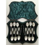 A set of twelve late Victorian teaspoons with engraved fancy terminals & writhen stems, & with