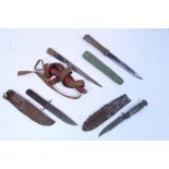 Two eastern daggers; & two bowie knives, each with sheath.